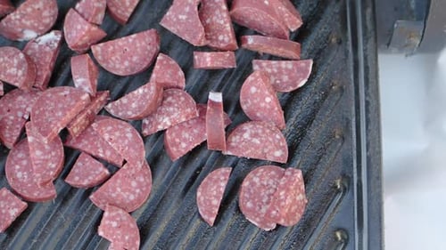 Sausage Slices Arranged on Grill Plate