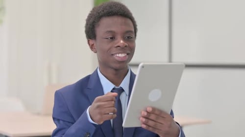 Young Man in Suit on Video Call