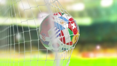 Soccer Football Ball with Flags of World Countries Scoring Goal on a Stadium of Cup of World
