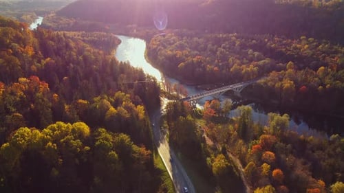 Autumn foliage Aerial View of Bridge Crossing River in Sigulda, Latvia