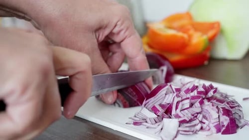 Chopping Red Onion on Cutting Board Close-up