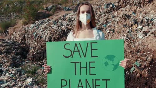 Young Adult Holding Save the Planet Sign