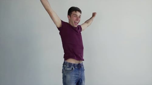 Man Celebrating with Arms Raised and Fist Pumping