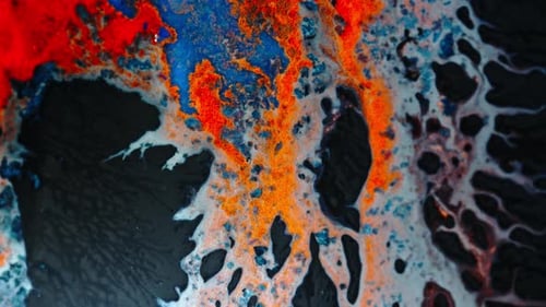 shot of colorful ink blending in liquid, creating dynamic and abstract patterns