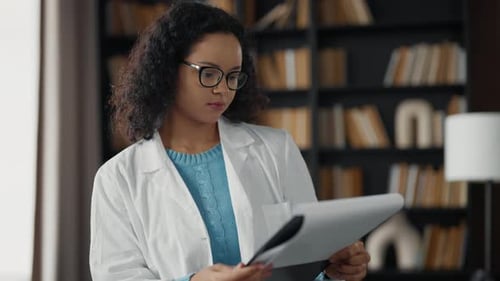 Young Woman Doctor in Hospital Office Serious Medical Student Girl Wearing White Medical Coat Look