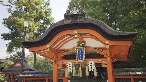 Red buildings of a historic shrine. The site features vibrant colors and intricate designs represent