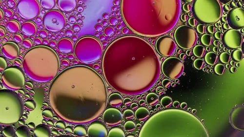 Colorful Oil Bubbles Moving On A Water Surface 132