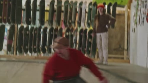 Skateboarder Riding at Indoor Skatepark