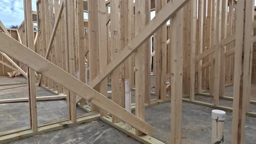 Wood Frame of House Under Construction in Daytime