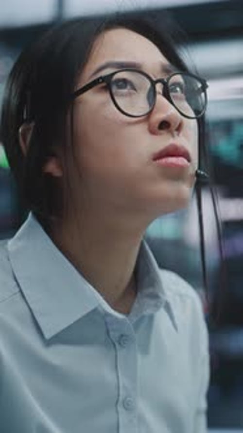 Focused Businesswoman Operates at Multi Monitor Workstation in Modern Stock Exchange Hub