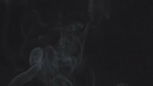Abstract Smoke Billows Against Black Background