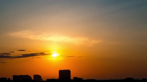 Sunrise over the City and Light Clouds