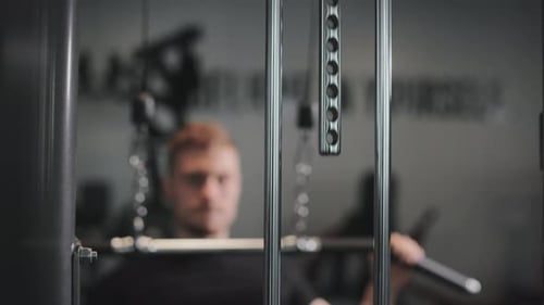 Man Doing Lat Pulldown Exercise in Gym