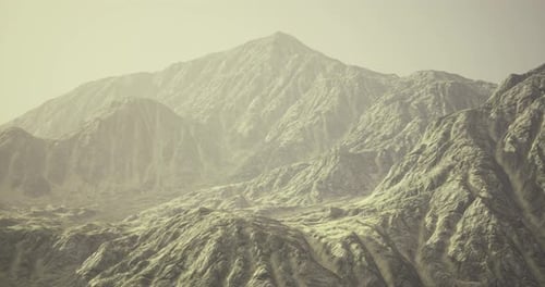 Majestic Mountain Range Under Soft Light During the Early Morning Hours