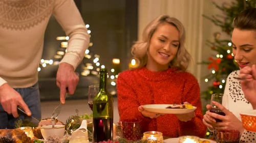Friends Enjoying Festive Christmas Dinner at Home