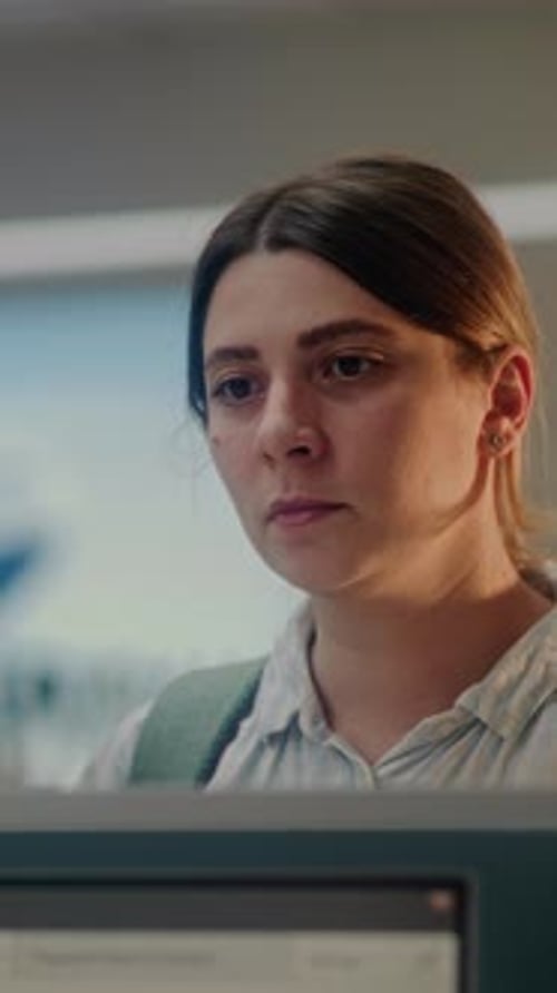 Close Up of Woman Waiting for Passport Control at Airport Checkin Counter