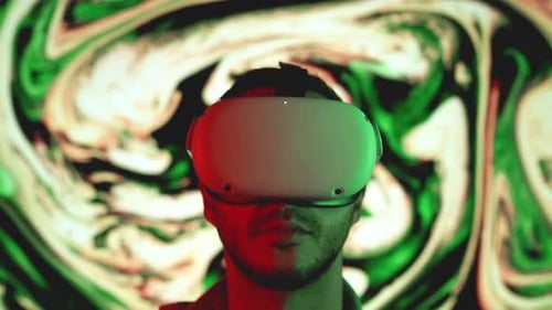 Adult Wearing Virtual Reality Headset with Graphic Background