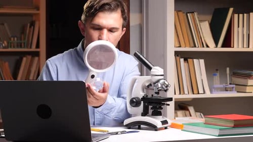 Adult Looking at Sample with Magnifying Glass