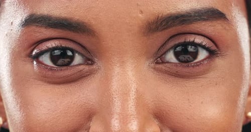 Eyes, woman and face closeup with vision wellness, eye care and makeup in a studio