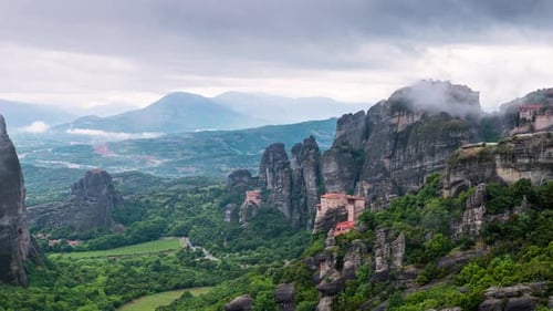Amazing view of moving clouds at Meteora valley in Greece
