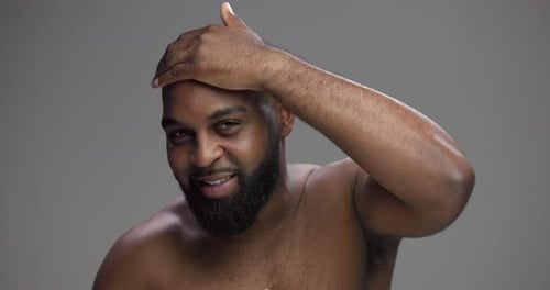 Hair, beauty and face of black man in studio for cleaning, shampoo and grooming