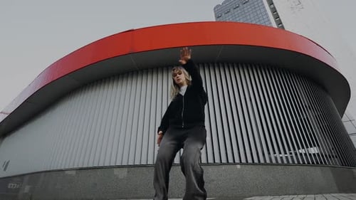 Young Woman Dancing Hip Hop on the Street