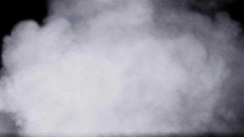 Thick Column Of Smoke Blowing In The Wind