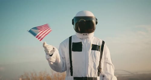 Astronaut on Earth Waving an American Flag
