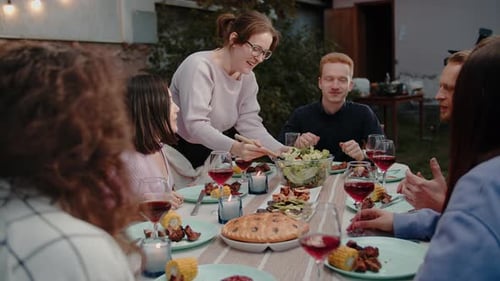 Friends Enjoying a Meal Together Outdoors