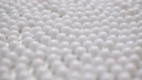 Pearls White Beads Rotating on a Turntable