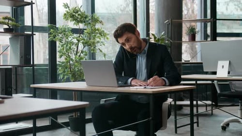 Multitasking Caucasian Businessman Working in Office Talking Client Mobile Phone Business Man Guy