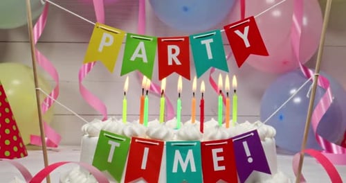 Celebratory Birthday Cake with Candles and Balloons