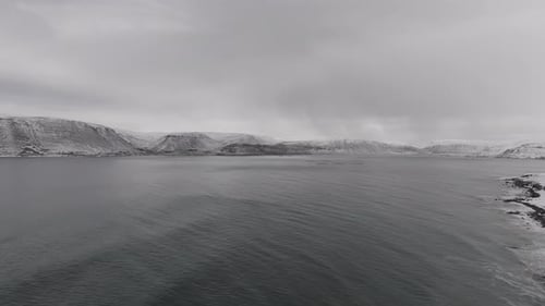 Aerial view of snowy mountains in Iceland in winter.