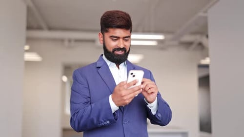 Successful Businessman Celebrates Good News on Phone