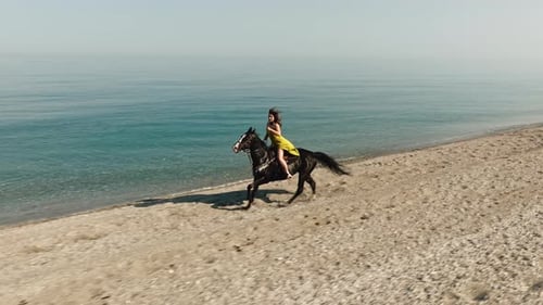 Woman on Horseback By the Beach