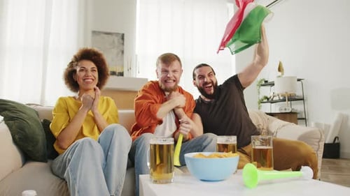 Friends Watching Sports Game at Home, Celebrating Victory