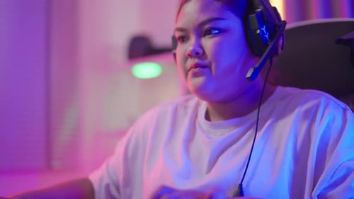 Teen Excitement While Gaming on Computer at Home