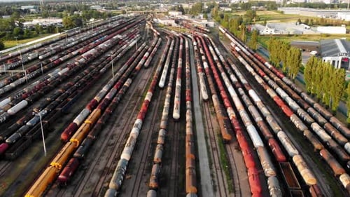 Aerial shot Showing Large Train Depot With Many colorful cargo Trains