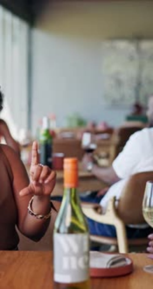 Happy, talking and women in restaurant with wine for social gathering, reunion and conversation