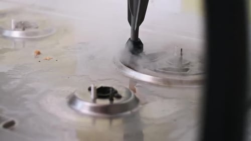 Steam Cleaning Gas Burner Close Up Slow Motion