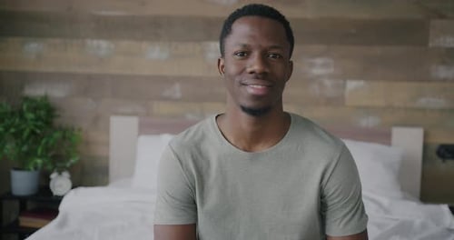 Man Smiling Portrait in Bedroom Interior