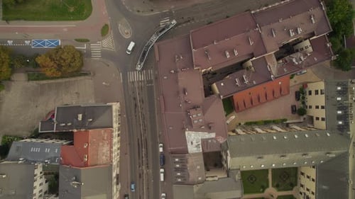 Aerial view looking down at tram travelling through Cracow Poland urban European city street
