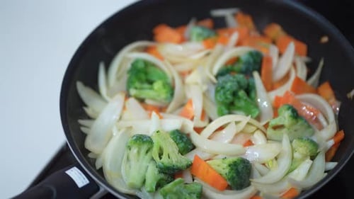Vegetables Sizzle in Frying Pan