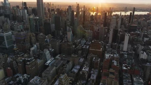 Aerial Views Capture the Empire State Building and Midtown Manhattan Glowing Warmly at Sunrise