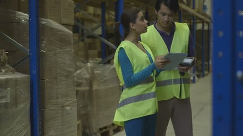 MS TU Engineers using digital tablet and barcode reader in factory