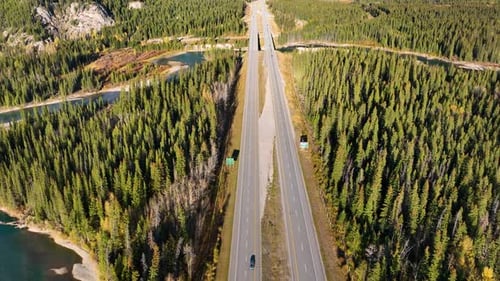 The road in the mountain valley. Traveling by car. Landscape from the air. Video for background.
