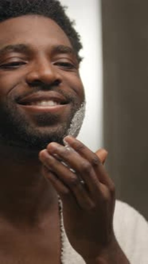 Man Applies Shaving Cream to His Face