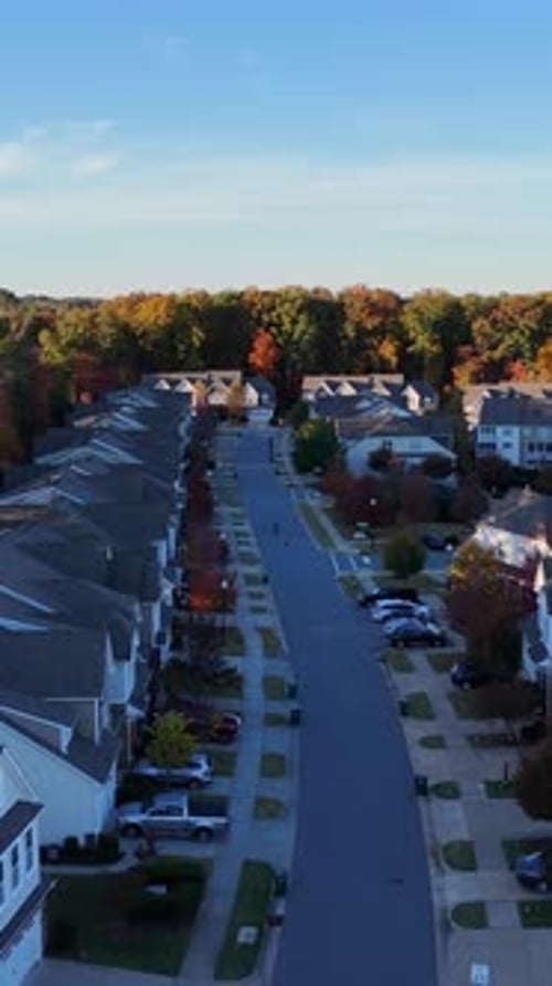 Aerial View of Suburban Street with Colorful Trees in Autumn USA Vertical Video