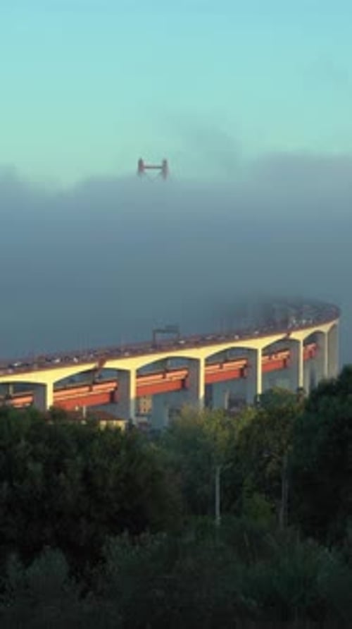 Ponte 25 De Abril Suspension Bridge in Fog Portugal Vertical Video