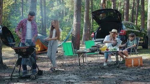 Family Barbecue Picnic in a Wooded Area